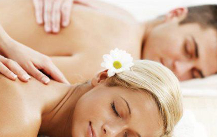 man and woman enjoying couple's massage