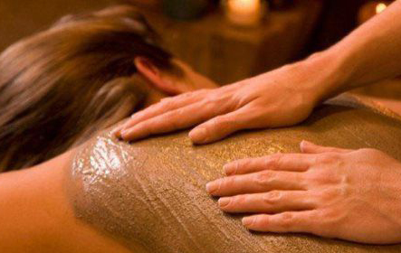 woman enjoying a mud massage